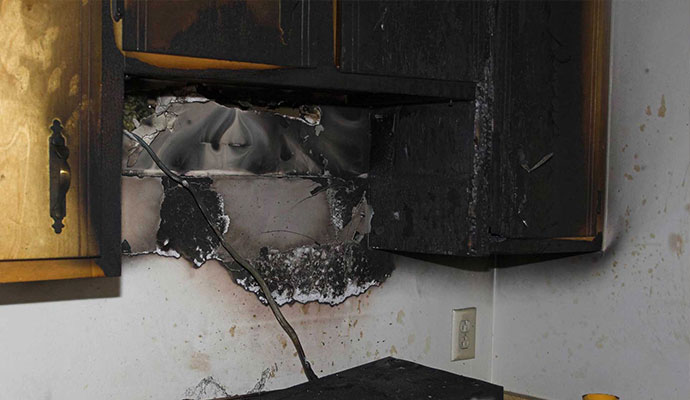 burn wall cabinet inside fire damage house