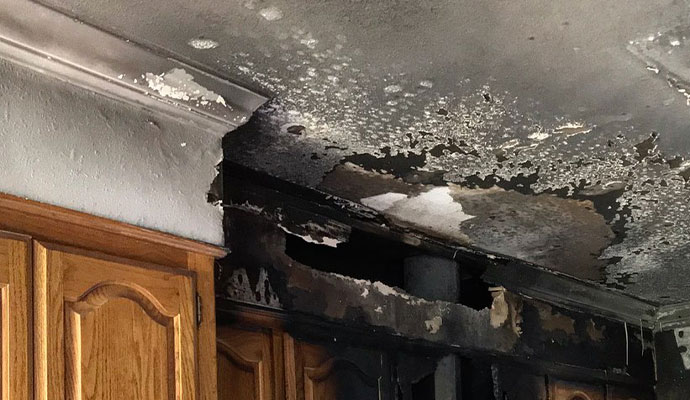 kitchen fire smoke damages wall and ceilling